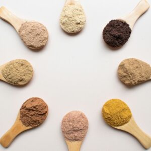 six different types of powdered spoons arranged in a circle